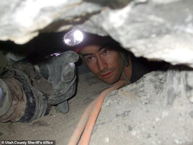 95138491-14405371-A_rescuer_from_Utah_Cave_Rescue_works_to_free_John_Jones_from_de-a-29_173979328007.jpeg