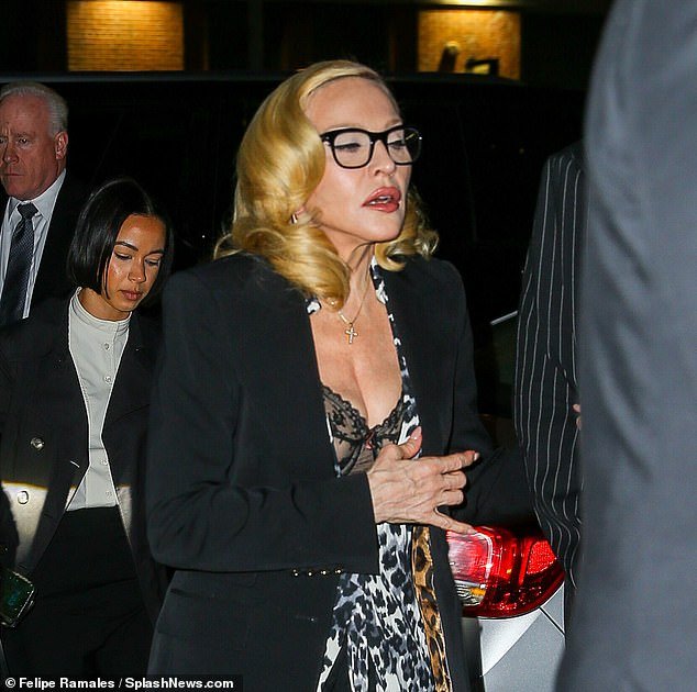 96121225-0-Madonna_ditched_her_signature_gloves_as_she_stepped_out_with_her-a-51_1741802422966.jpg