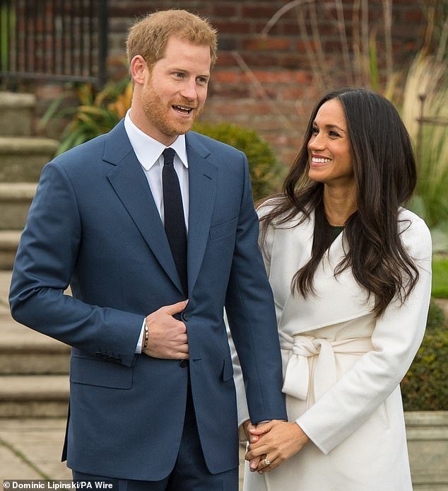 98754155-14749531-Meghan_pictured_with_Prince_Harry_after_their_engagement_announc-a-66_174861438079.jpeg