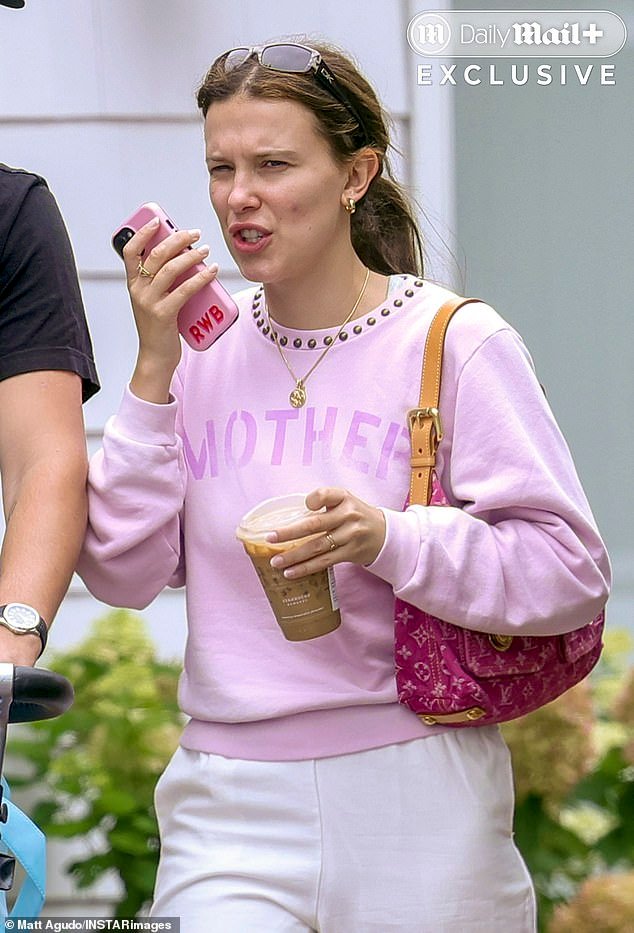 101438053-15025539-Brown_who_carried_a_2850_Louis_Vuitton_handbag_was_also_seen_spe-a-18_17558782621.jpeg