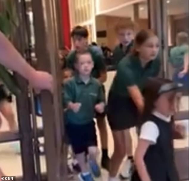 101637945-15044051-The_grim_clip_obtained_by_CNN_shows_dozens_of_kids_fleeing_the_c-m-1_175639942351.jpeg