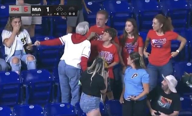 101892753-15074645-A_woman_Phillies_fan_white_jersey_was_seen_berating_a_man_for_be-a-20_17572610558.jpeg