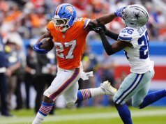 Michael Irvin desgastó a la defensiva de los Cowboys con una valiente actuación contra los Broncos