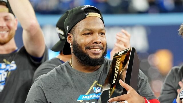 vladimir-guerrero-jr-holds-trophy.jpg