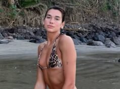 Dua Lipa hace alarde de su asombrosa figura con un diminuto bikini con estampado de leopardo mientras su prometido Calum Turner va sin camisa mientras van a la playa en medio de su escapada romántica.