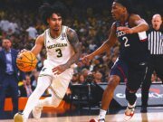 El armador Elliot Cadeau acordó regresar a Michigan para su último año