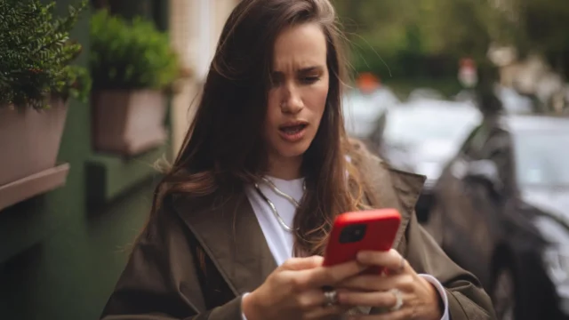 serious-woman-upset-by-bad-news-on-smartphone.webp.webp